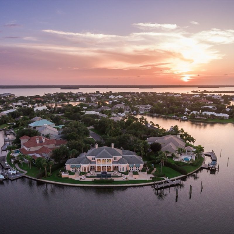 Riverfront homes at sunset